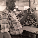 Tobacco roller Alfred Malone at R.C. Owens Tobacco Company in Gallatin, where he began making tobacco twists in the 1920s.  Photo by Robert Cogswell, 1985.