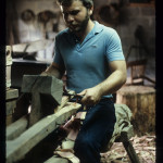 Rick Stewart, of Panther Creek, uses a drawknife and shaving horse.  He took up the coopering craft of his grandfather Alex Stewart, who received the National Heritage Fellowship in 1983.  Photo by Robert Cogswell, 1985.