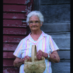 Basketmaker Alberta Underwood, of Morrison, with one of her later baskets.  Photo by Robert Cogswell, 1999.