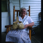 Basketmaker Josie Jones, of Smithville, with one of her “gizzard” baskets.  Photo by Robert Cogswell, 1999.