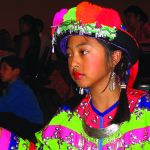 Girl in Lao tribal costume during a youth performance at the 25th anniversary of the Royal Lao Dance Troupe’s relocation, in Smyrna.  Photo by Robert Cogswell, 2005