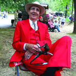 Old-time singer Roy Harper, of Manchester, at the Mountaineer Folk Festival.  A recipient of the Tennessee Folklife Heritage Award in 2003, Harper makes use of this handmade harmonica and kazoo rack in his performances.  Photo by Robert Cogswell, 2006.