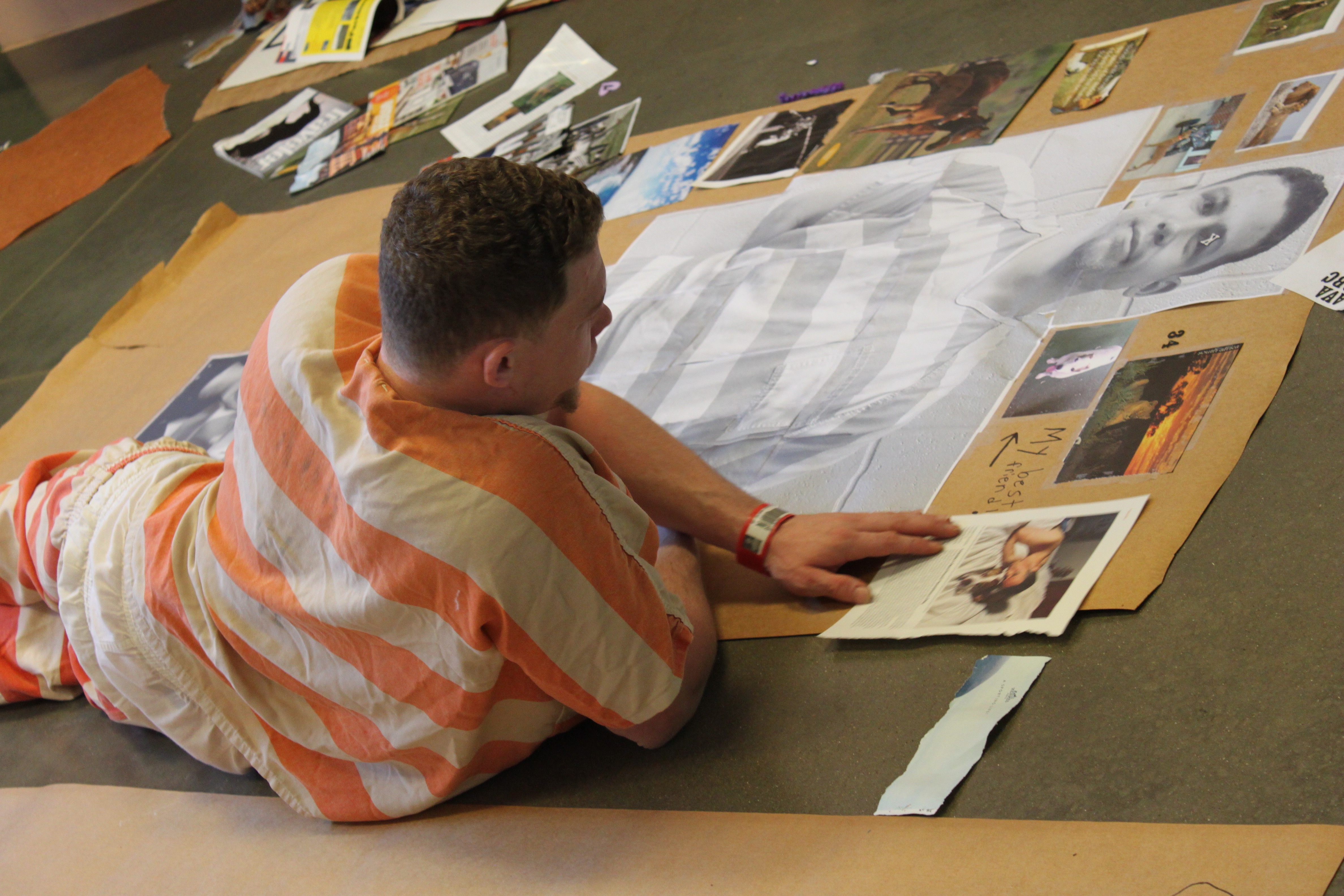 Inmate working on his collage 
