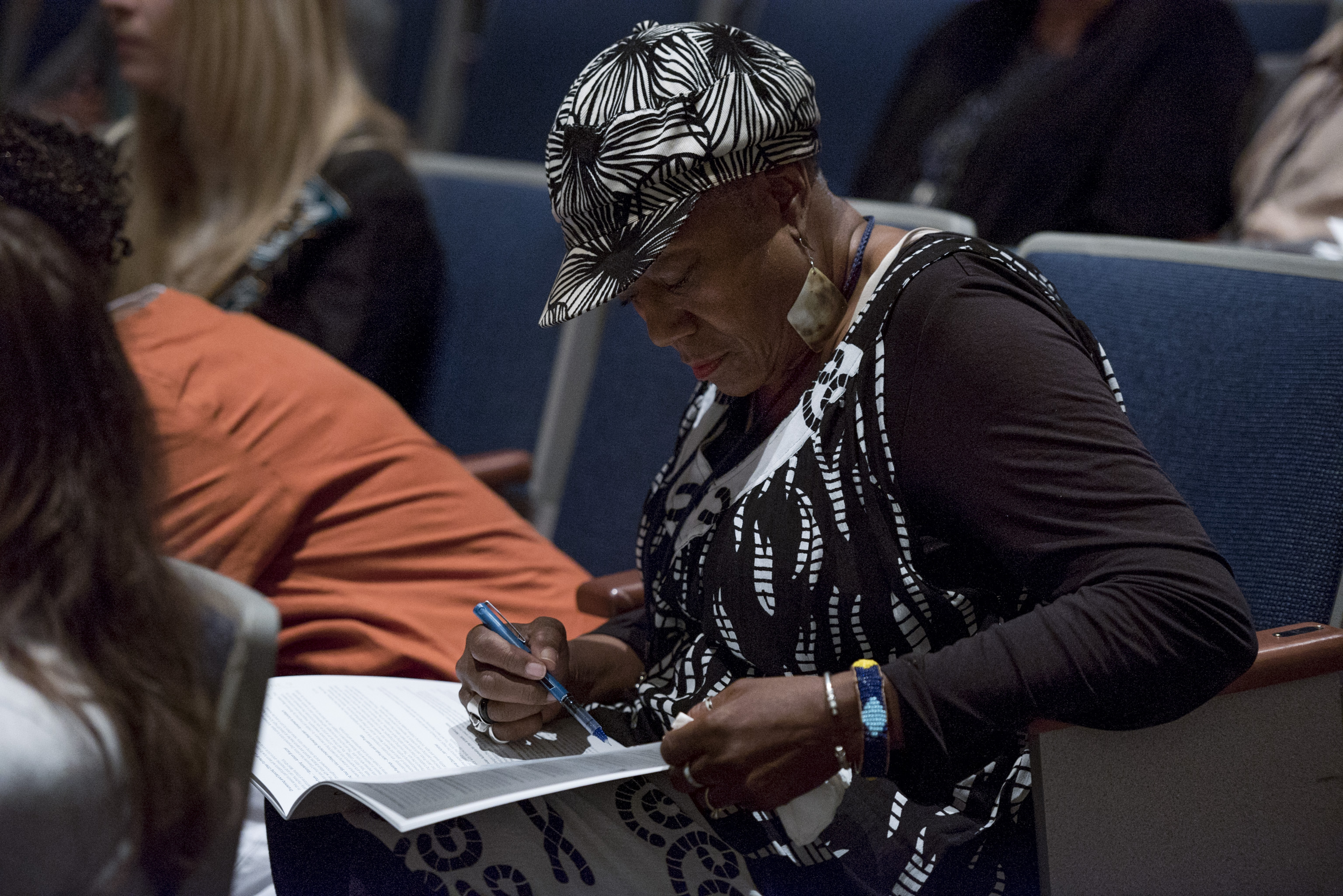 Collective Impact attendee taking notes at the conference