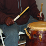 Close-up of master drummer Mawuko on the Ewe drum. 