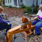 Williams and Kucharski processing the wood to make the parts of the white oak basket.