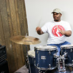 Kenneth Artison, apprentice, on drums during a practice session in February 2018.