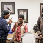 Guest teacher Willie Hurt guides apprentice Kesha Burton as she begins to play the fife that he made her. R.L. Boyce, on drums, watches, at the West Tennessee Delta Heritage Center, in Brownsville, in January 2018.