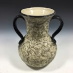 white stoneware clay with black colored slip and glaze, 9.25 x 7.25 inches