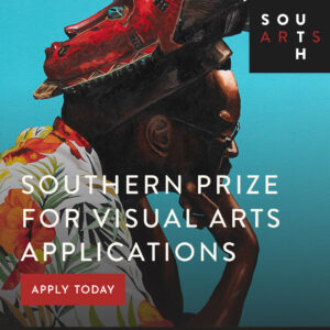 A person wearing glasses and a floral shirt is shown in profile, resting their chin on their hand, with a red mask balanced on their head. The image promotes the Southern Prize for Visual Arts applications.